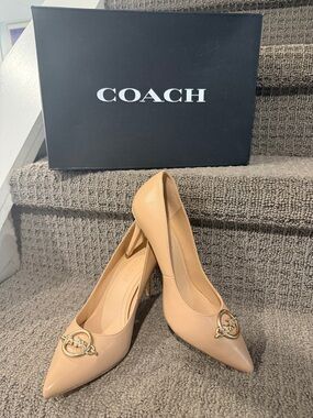 Coach Nude Leather Pointed-Toe Pumps with Gold Logo